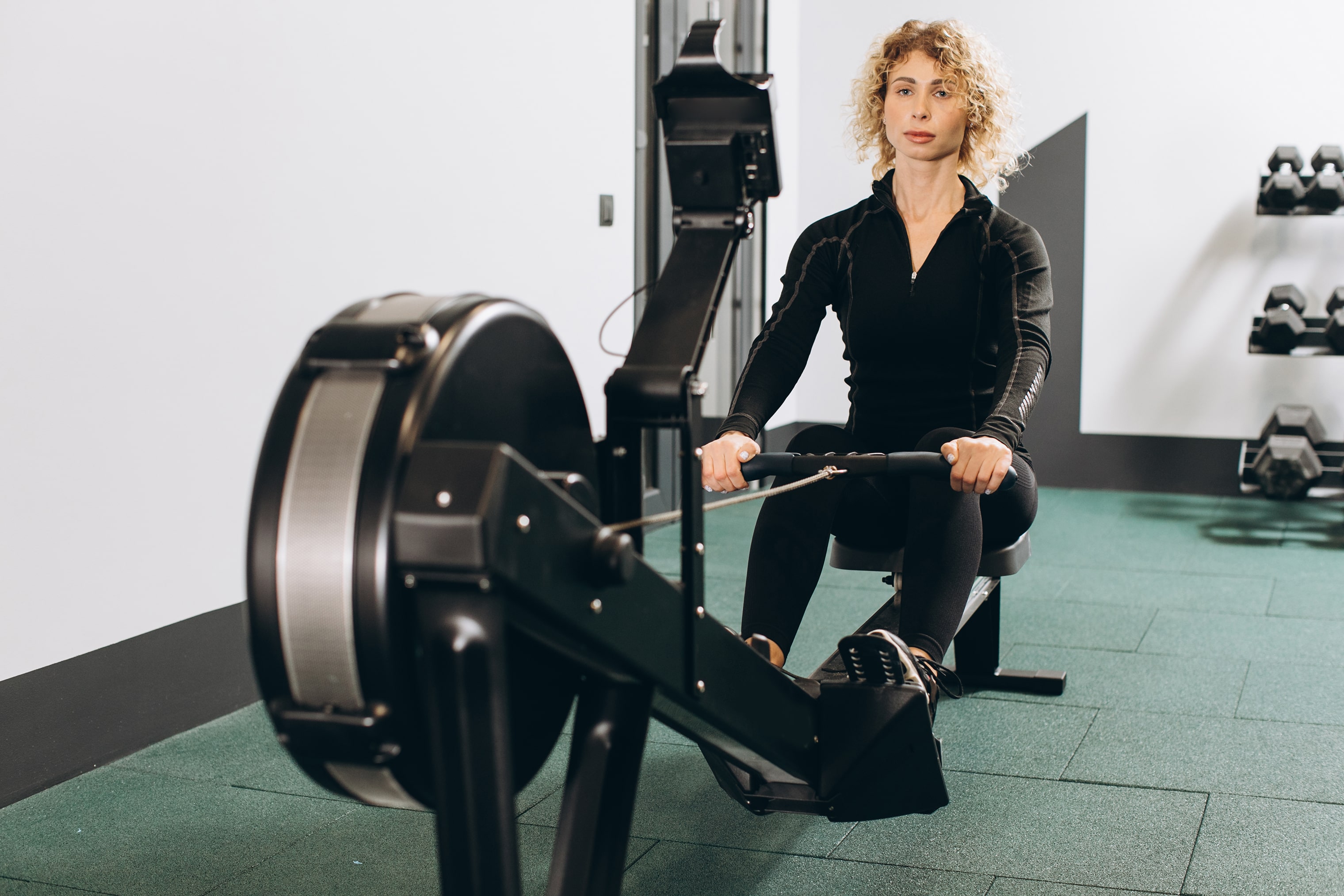 woman-exercising-on-rowing-machine-part-of-circuit
