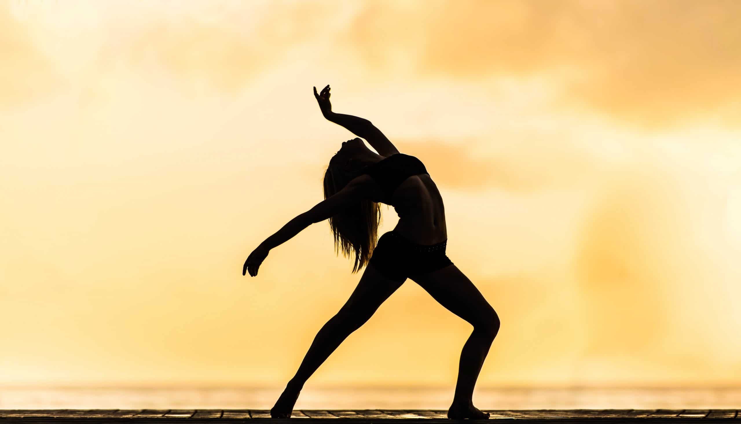 Girl in silhouette exercising | Fitness Expo