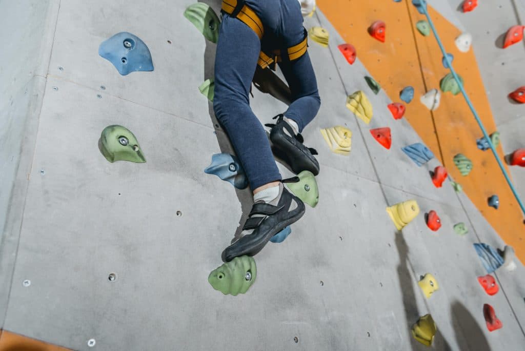 Climbing Gym Walls with Grips and Harness
