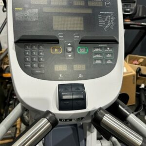 Elliptical machine in a gym with a monitor on it.
