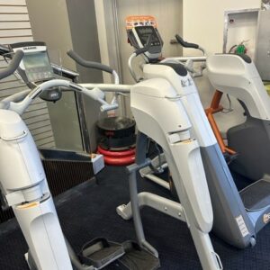 A group of exercise machines in a gym.